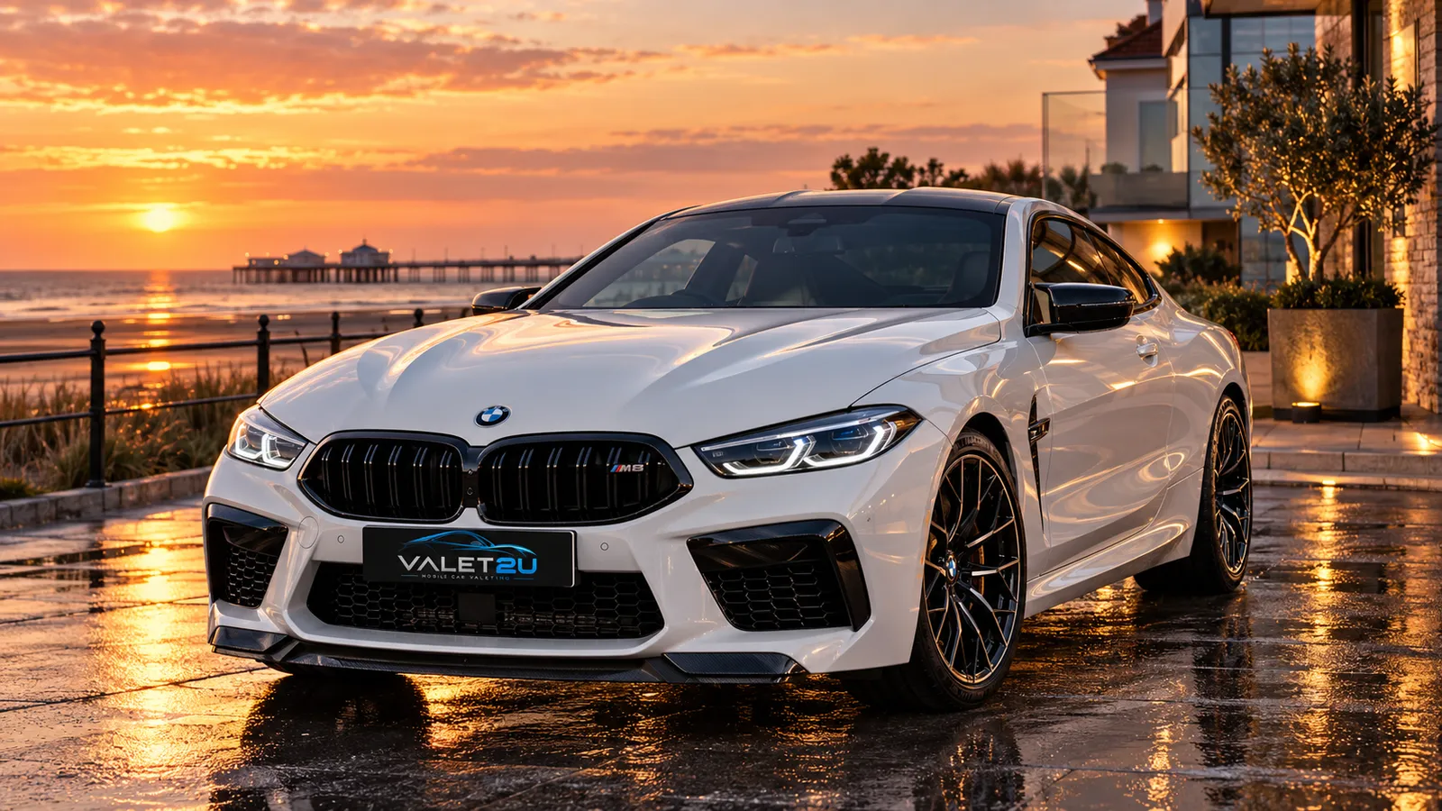 White coupe beside a coastal promenade at sunset. Staging artwork.